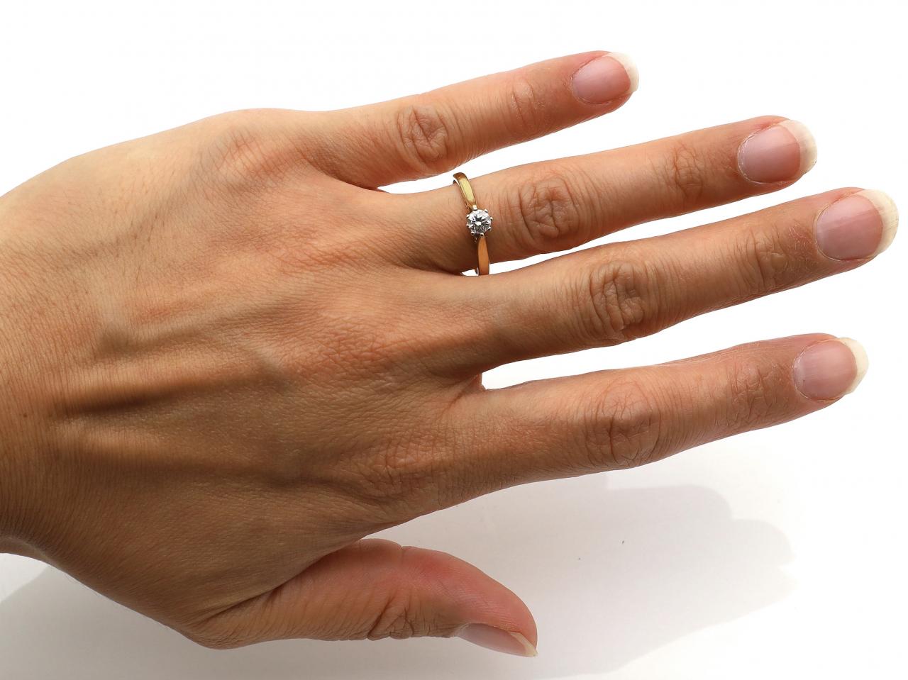 Vintage diamond solitaire engagement ring in gold