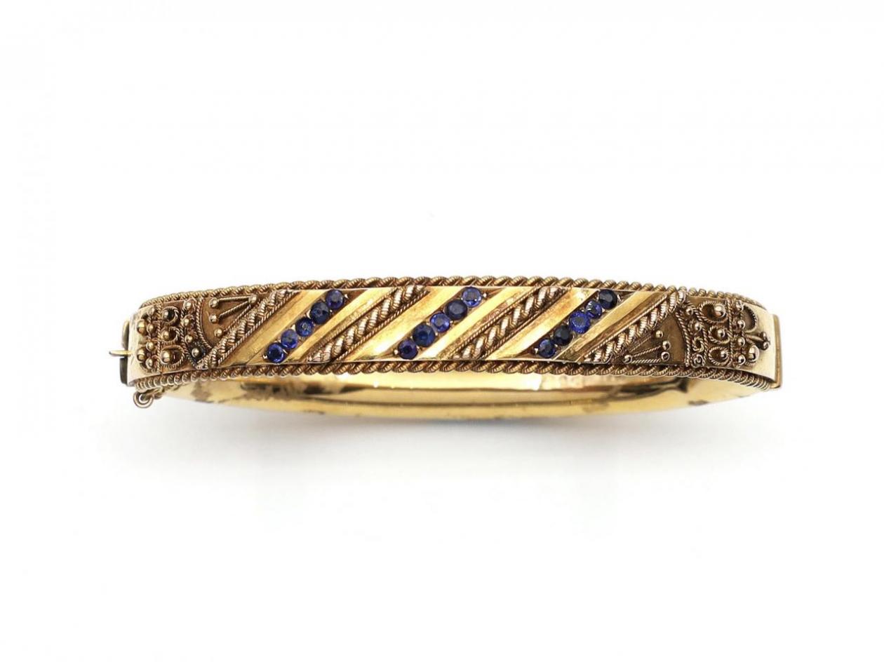 Vintage hollow 9kt yellow gold hinged bangle set with sapphires