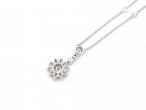Dainty diamond set flower necklace with spectacle set diamonds