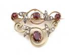 Garland style ruby and diamond brooch in yellow gold