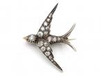 Victorian diamond set swallow bird brooch in silver on gold