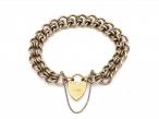 1987 solid yellow gold curb bracelet with heart lock