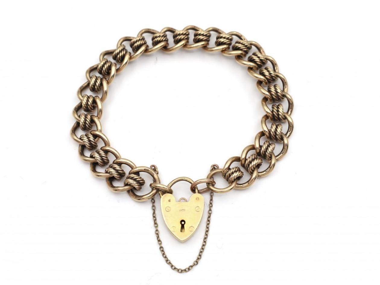 1987 solid yellow gold curb bracelet with heart lock