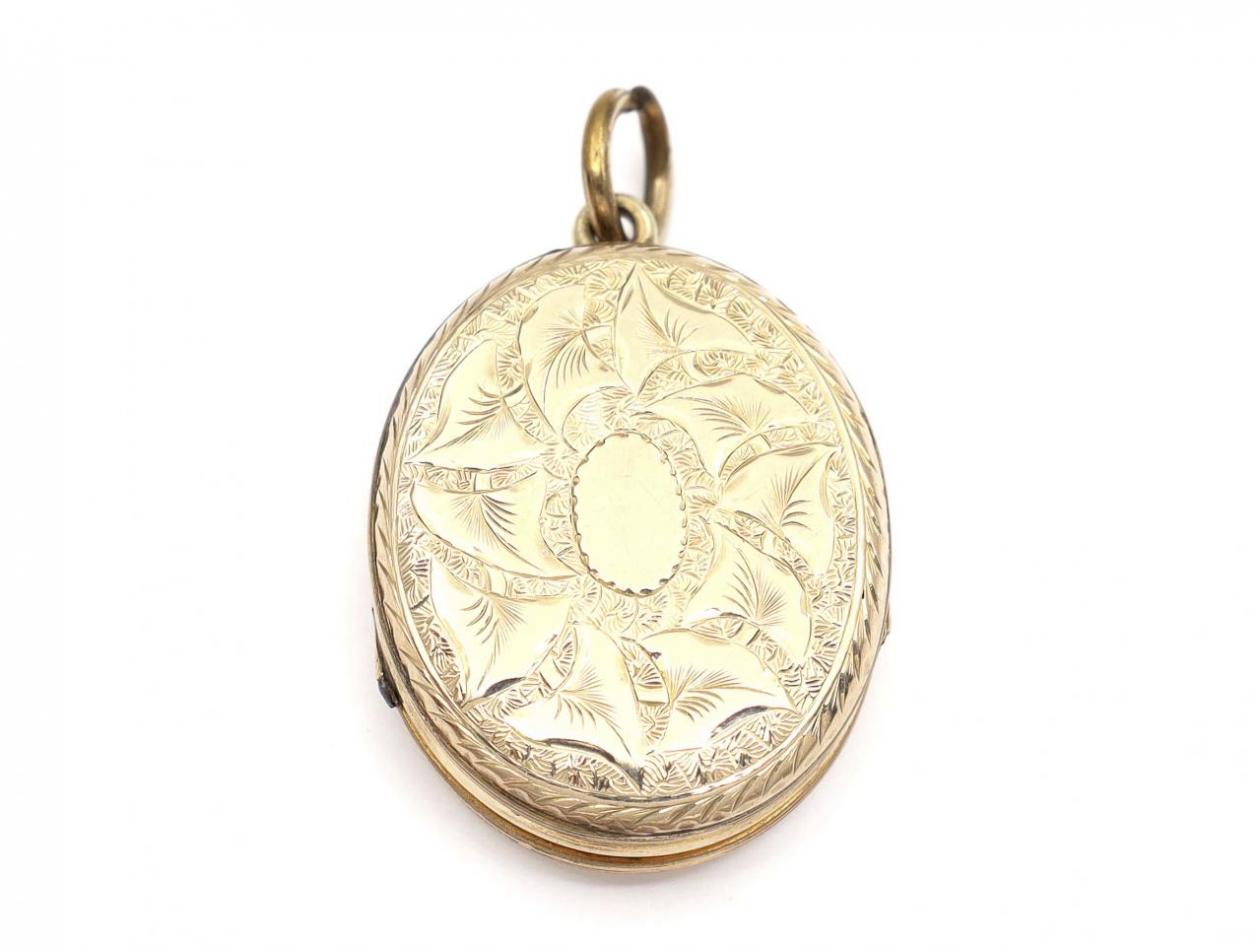 Antique 9kt yellow gold oval family locket