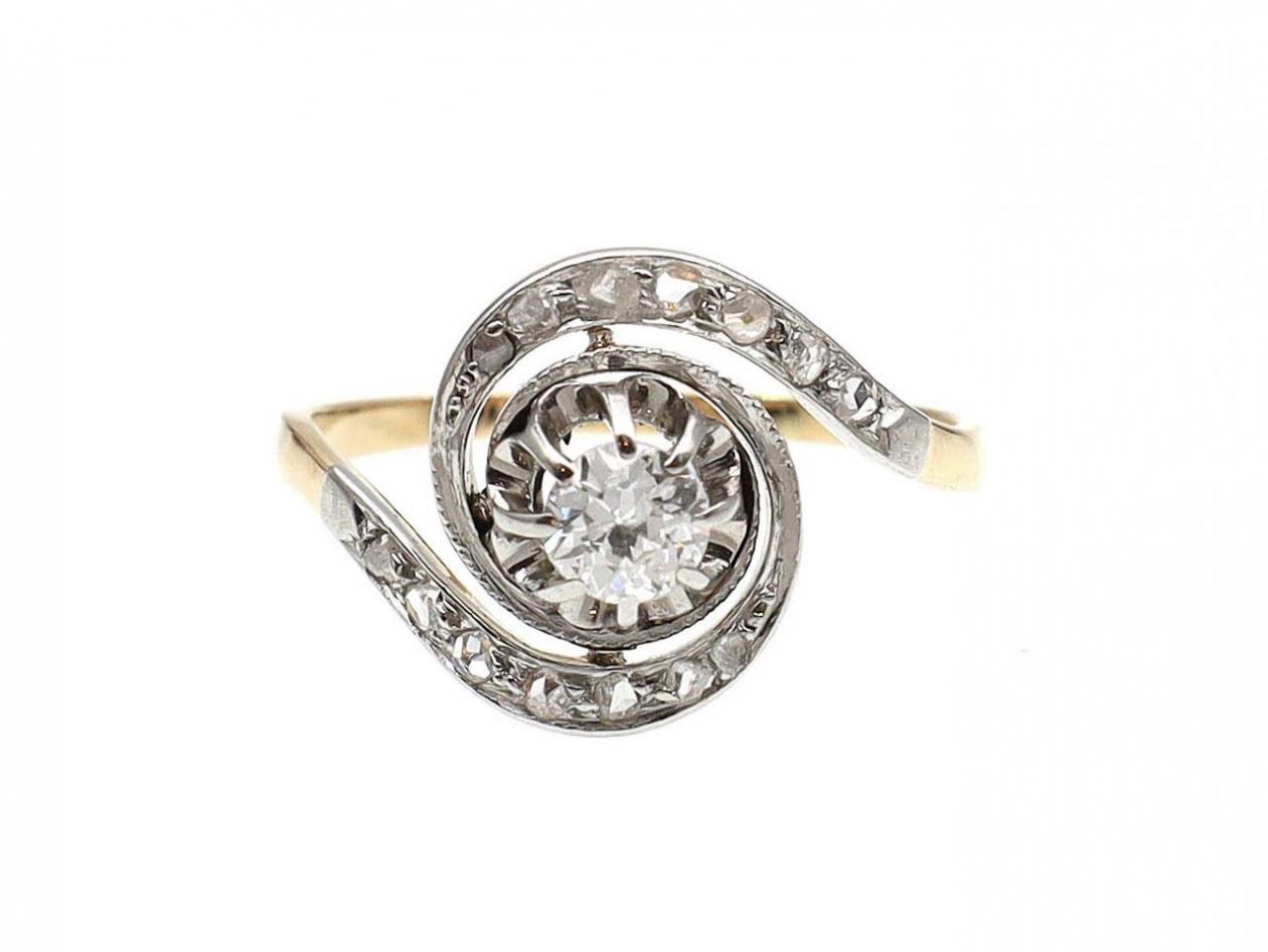 Art Nouveau diamond solitaire ring with twist shoulders