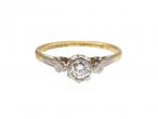 Antique diamond solitaire ring with fleur de lis shoulders