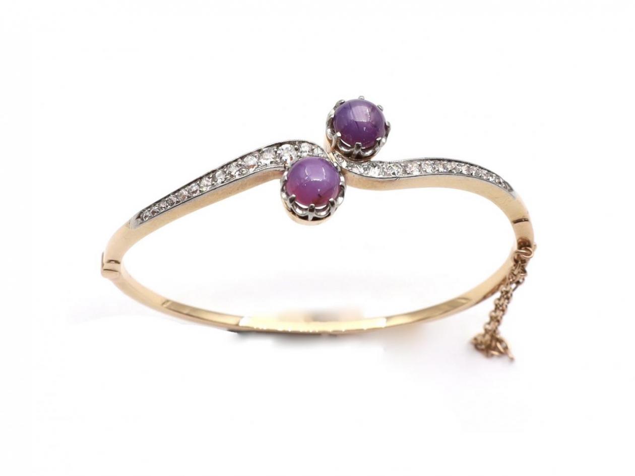 Antique two stone star ruby and diamond twist bangle in gold