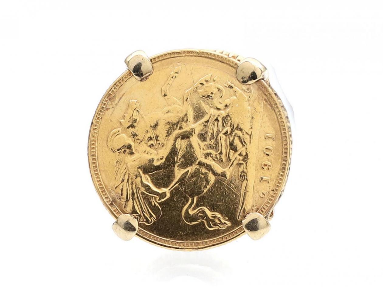 Vintage half sovereign ring in a high elaborate 9kt gold setting
