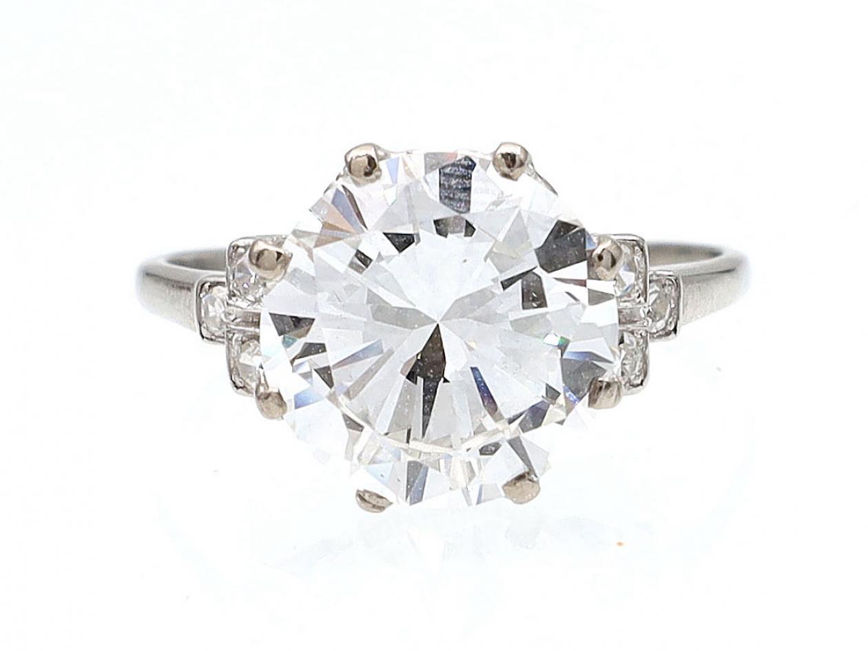 Edwardian 3.98ct diamond solitaire ring with diamond set shoulders