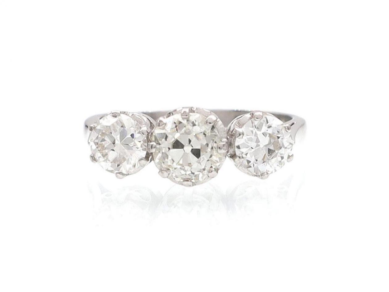 Vintage three stone round cut diamond ring in 18kt white gold