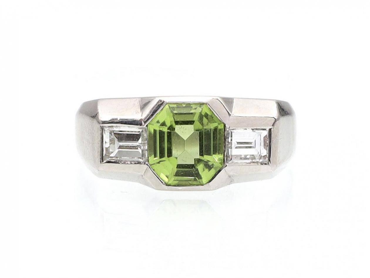 Art Deco peridot and diamond three stone ring in platinum