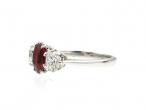 Contemporary oval ruby and diamond three stone ring