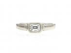 Art Deco style emerald cut diamond east to west diamond solitaire ring