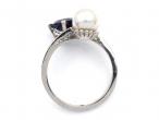 Cultured pearl and sapphire crossover ring in 18kt white gold