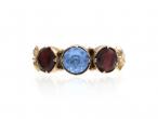 Antique blue paste and garnet foil back three stone ring