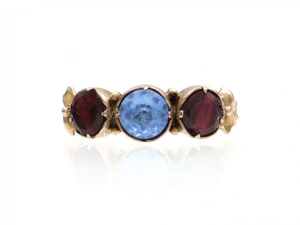 Antique blue paste and garnet foil back three stone ring