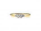 18kt yellow gold flanked diamond solitaire engagement ring
