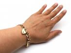 1967 oval curb link heart lock bracelet in yellow gold