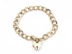 1967 oval curb link heart lock bracelet in yellow gold