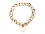 1967 oval curb link heart lock bracelet in yellow gold