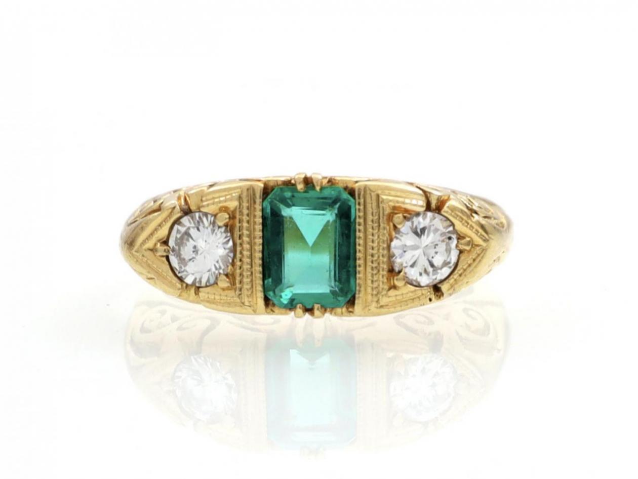 Antique emerald and diamond three stone carved ring