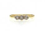 Vintage 18kt yellow gold three stone diamond ring