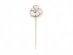 White enamel and diamond flower stick pin