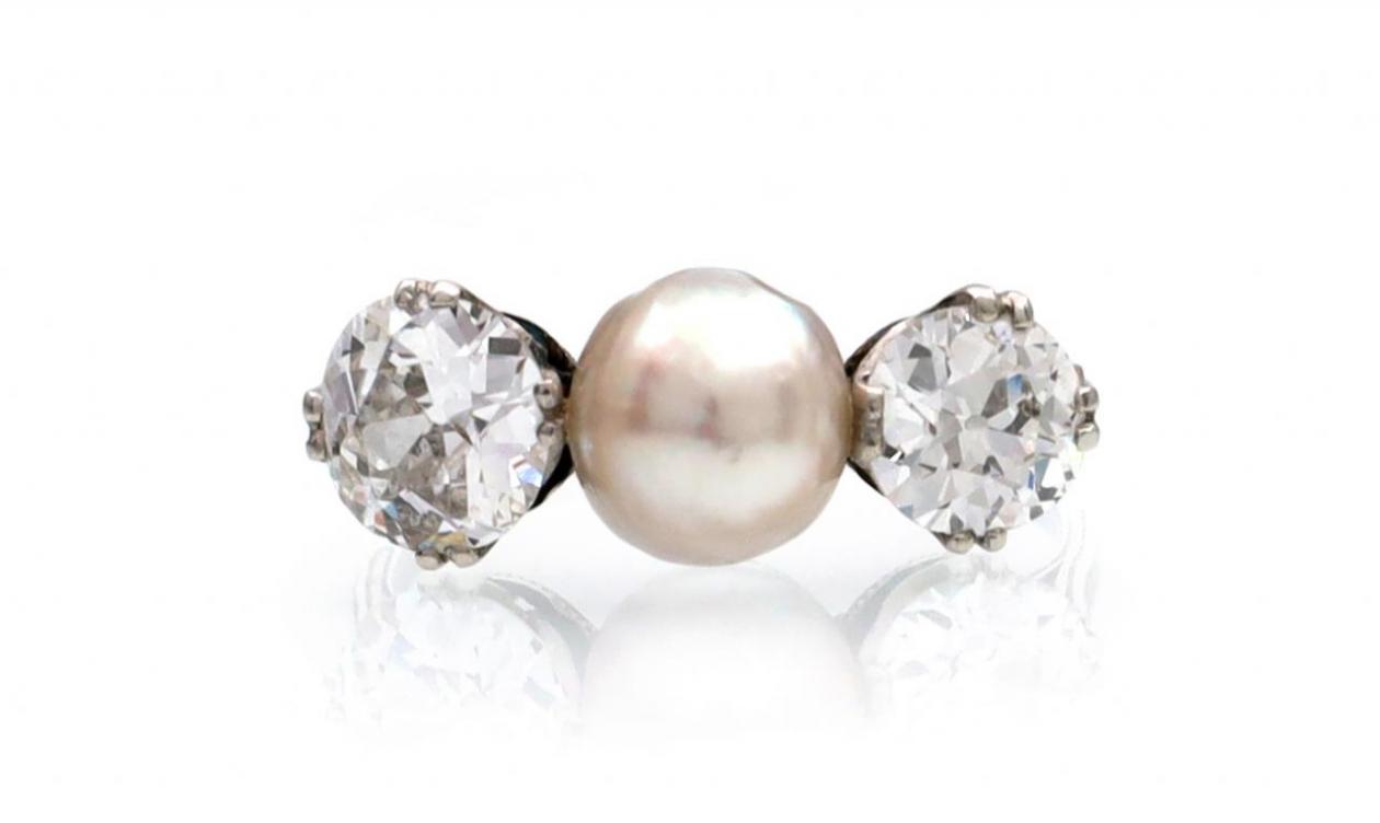 Edwardian natural pearl and diamond three stone ring