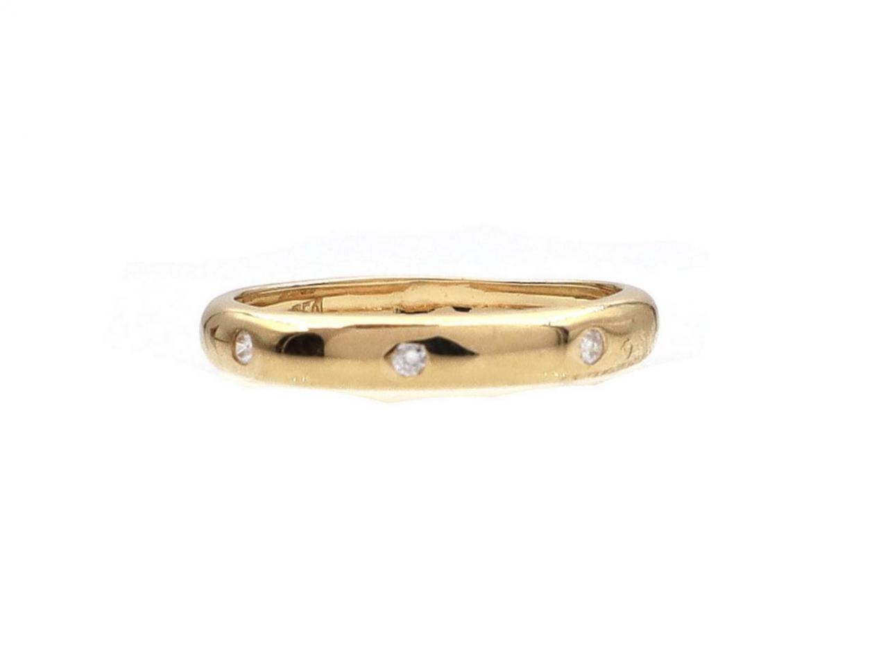 Contemporary three stone diamond wedding ring in gold