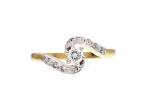 Diamond solitaire twist engagement ring in 18kt yellow gold
