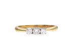 Three stone diamond engagement ring in 18kt yellow gold