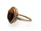 Antique carved tiger's eye sun man ring in 18kt rose gold