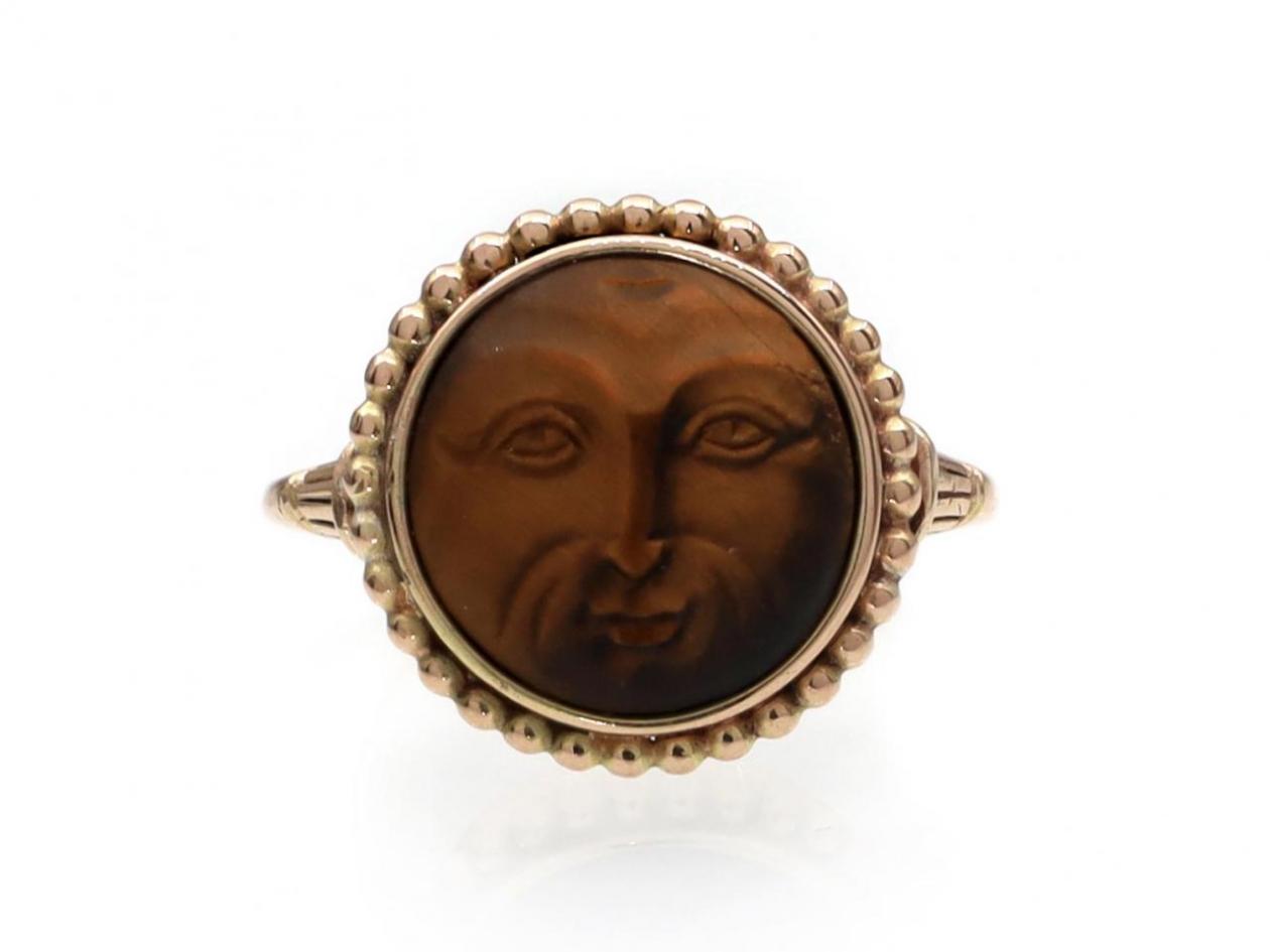 Antique carved tiger's eye sun man ring in 18kt rose gold