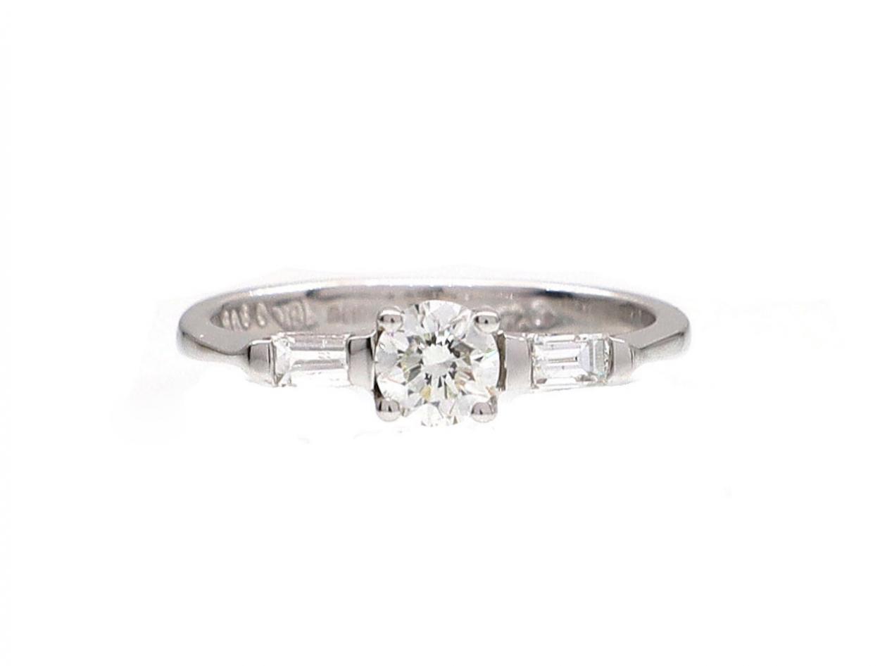 Contemporary diamond solitaire engagement ring in 18kt white gold