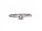 Four claw round brilliant cut diamond solitaire ring