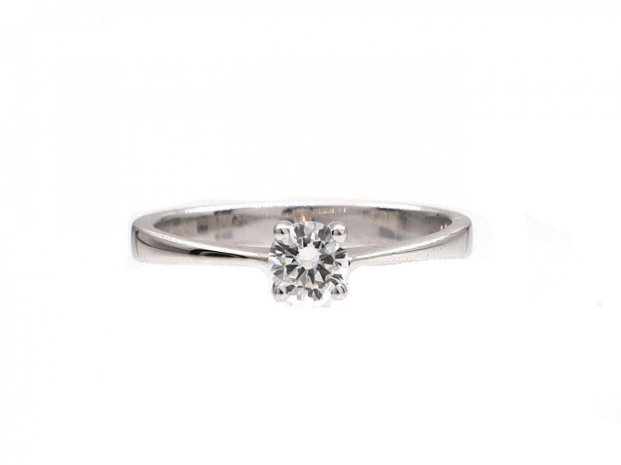 Four claw round brilliant cut diamond solitaire ring
