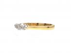 Contemporary graduating diamond three stone ring in 18kt yellow gold