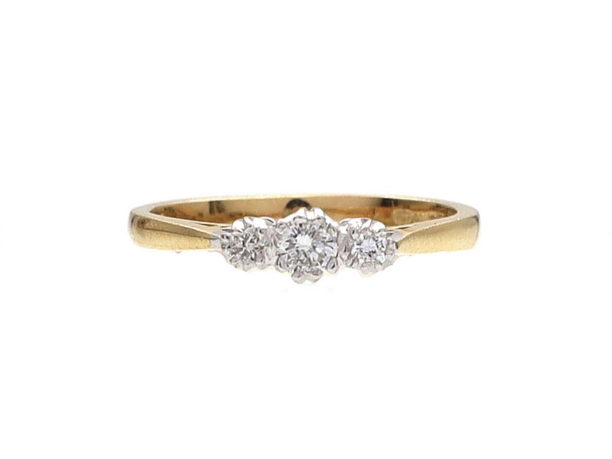 Contemporary graduating diamond three stone ring in 18kt yellow gold