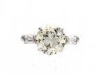 2.40cts round Old European cut diamond flanked solitaire ring