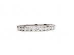 Diamond channel set half eternity ring in 18kt white gold
