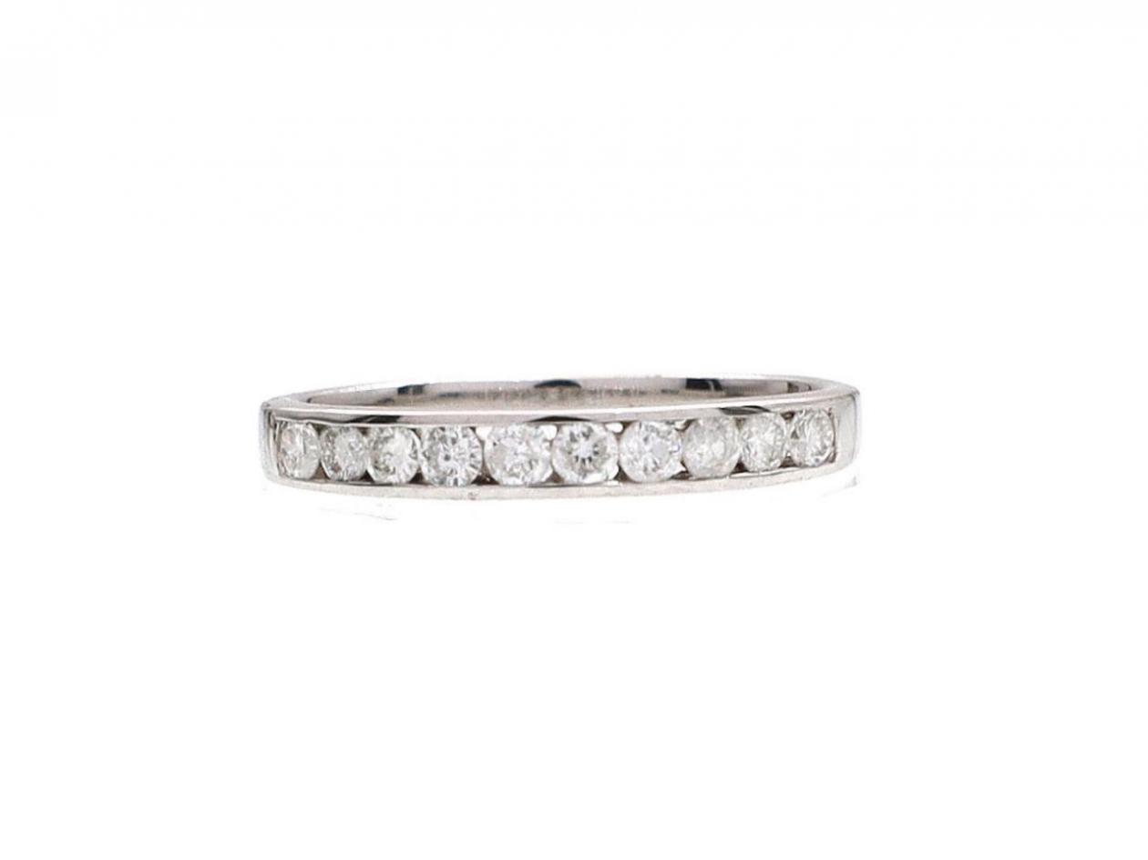 Diamond channel set half eternity ring in 18kt white gold