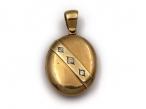 1877 oval locket with diamond set sash in 18kt yellow gold