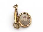 Victorian horse stirrup and horseshoe oval locket in gold