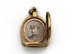 Victorian horse stirrup and horseshoe oval locket in gold