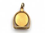 Victorian horse stirrup and horseshoe oval locket in gold