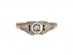 Antique diamond solitaire engagement ring with leaf motifs