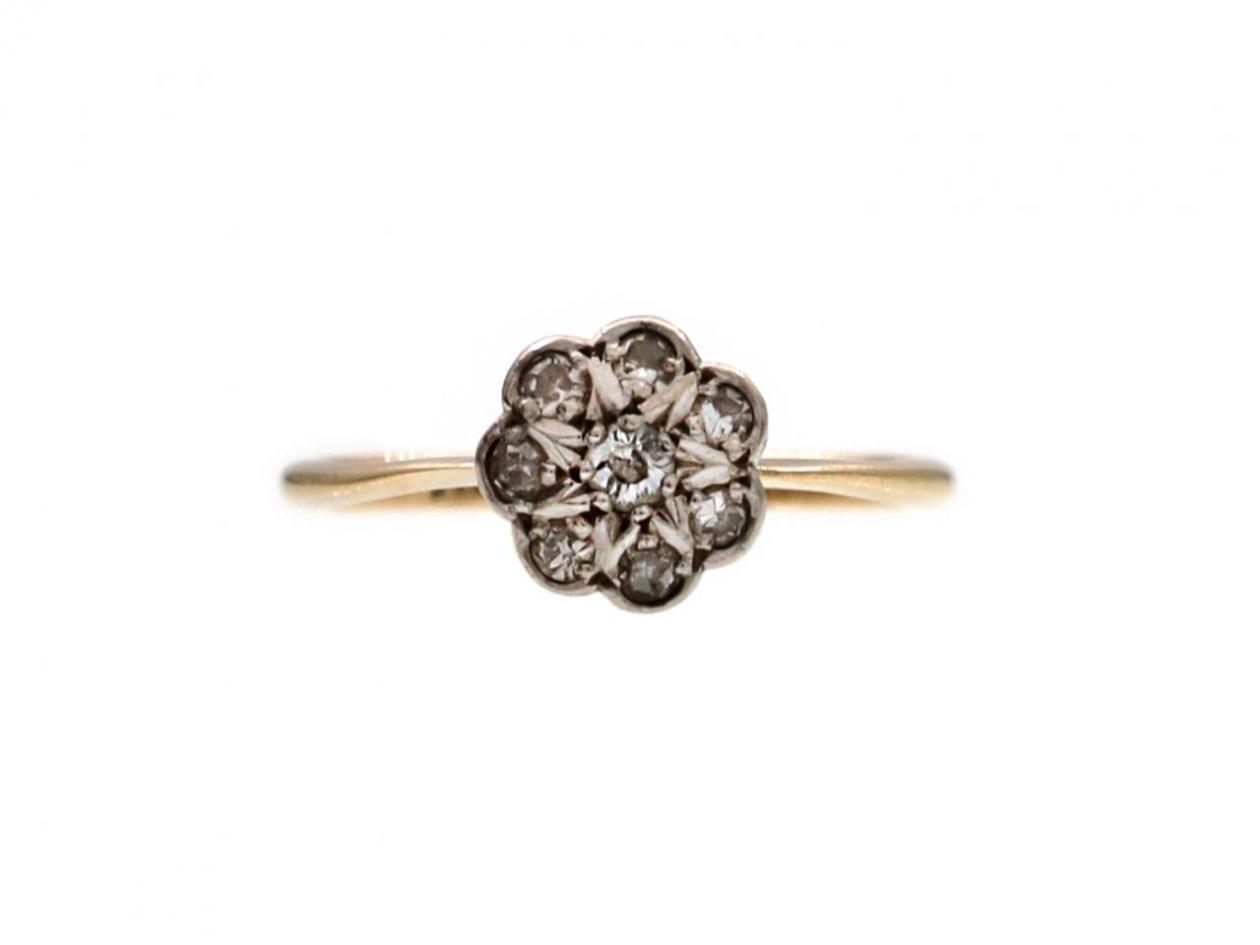 Antique diamond daisy cluster ring in platinum and 18kt yellow gold