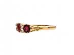 1889 ruby and diamond three stone carved ring in 18kt yellow gold