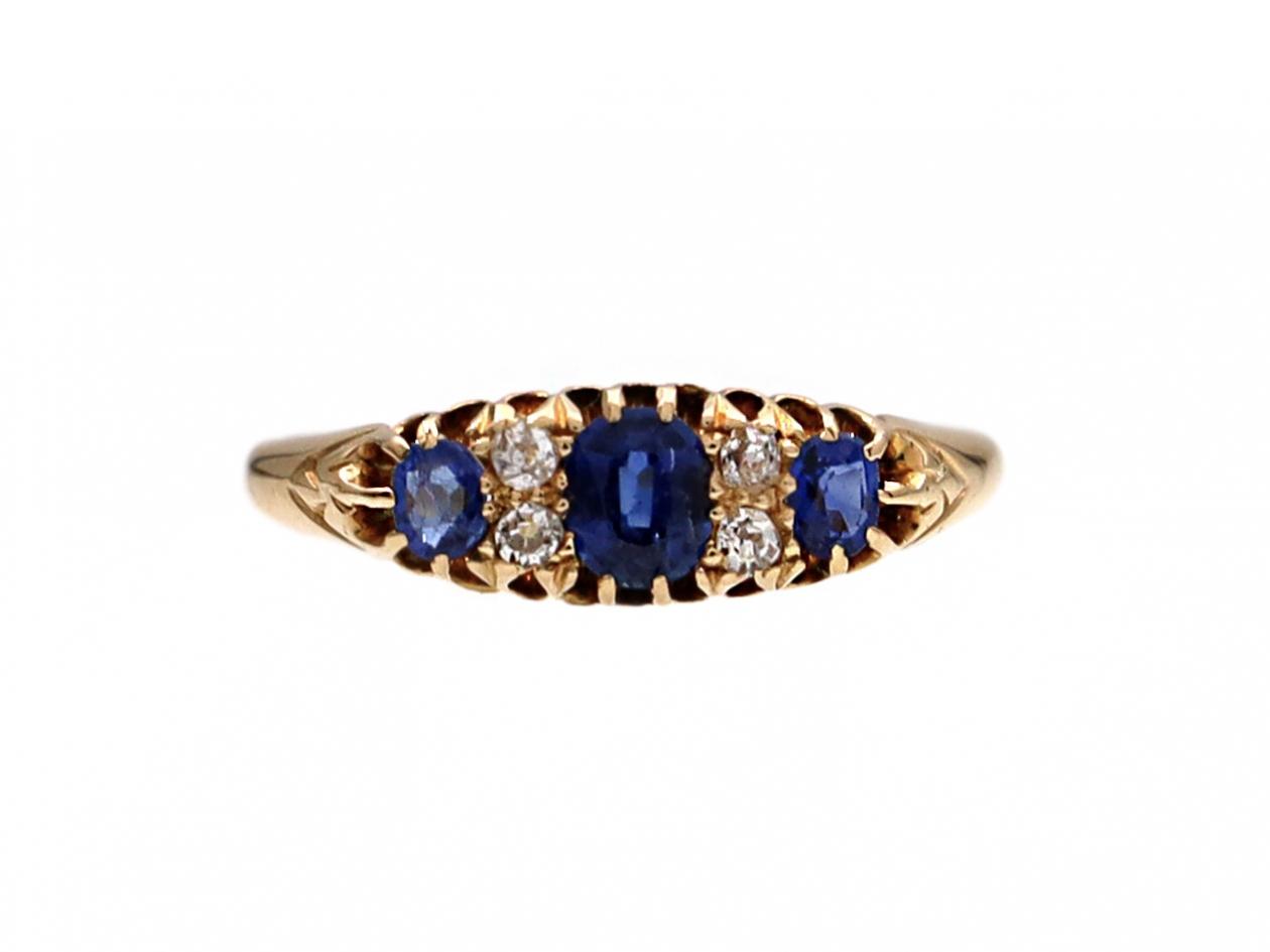 1910 sapphire and diamond three stone ring in 18kt yellow gold