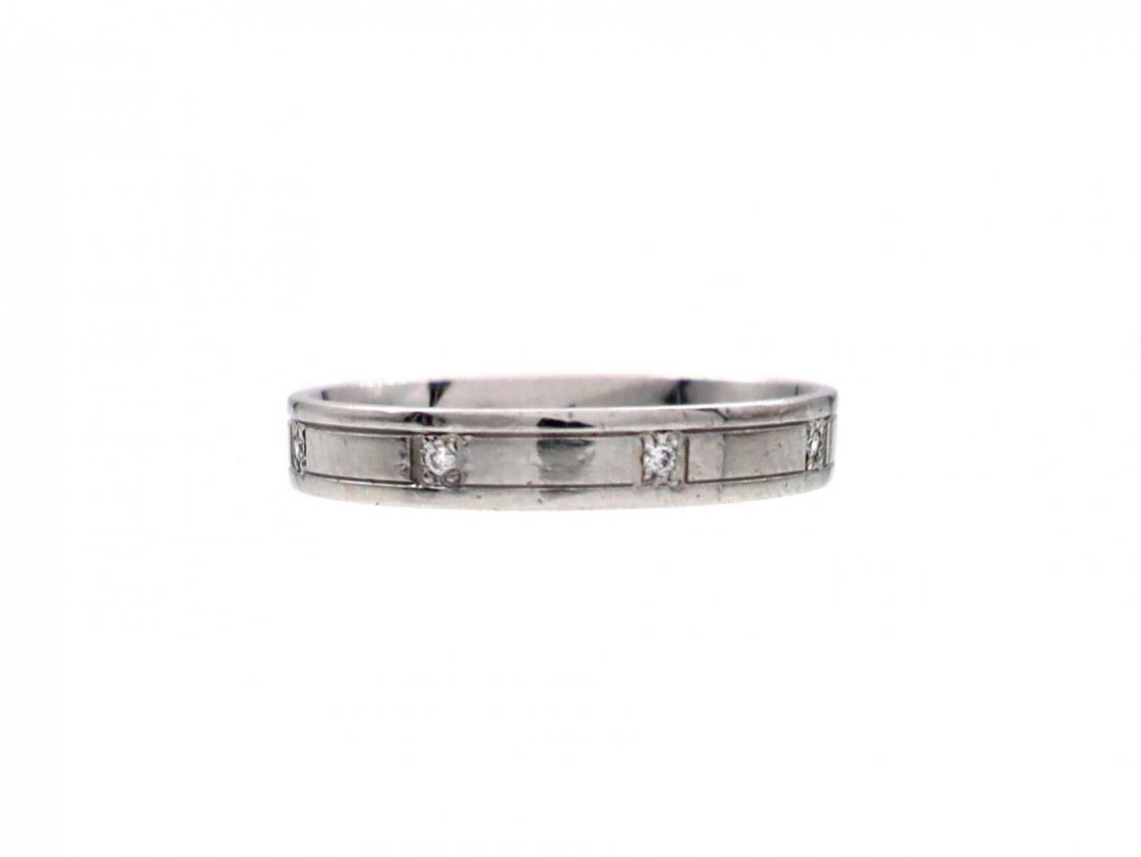 Platinum diamond set ring with incised borders